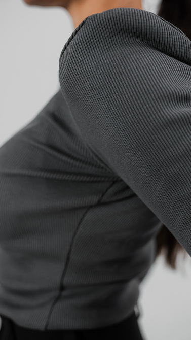 Ribbed knit blouse with long sleeves and shoulder pads