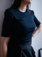 Ribbed knit blouse with short sleeves and shoulder pads