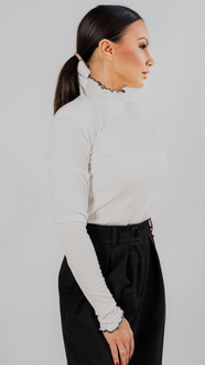 Blouse made of openwork knit fabric in ecru color and black trim