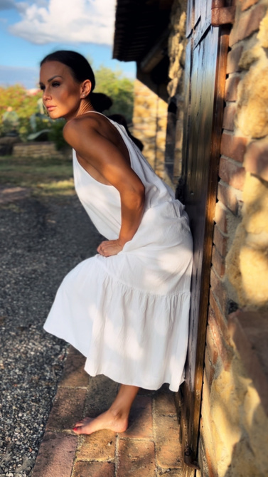 Maxi dress with ruffled neckline tied with string and ruffles